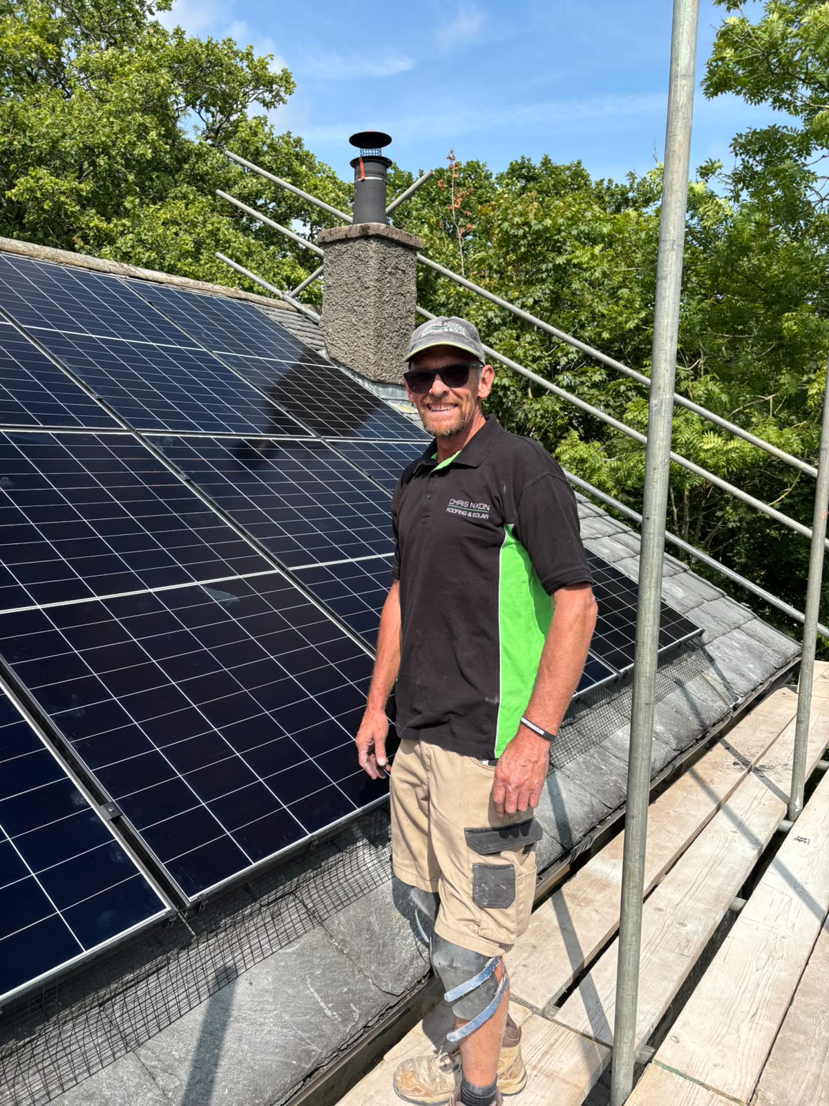 Experienced roofer on a slate roof
